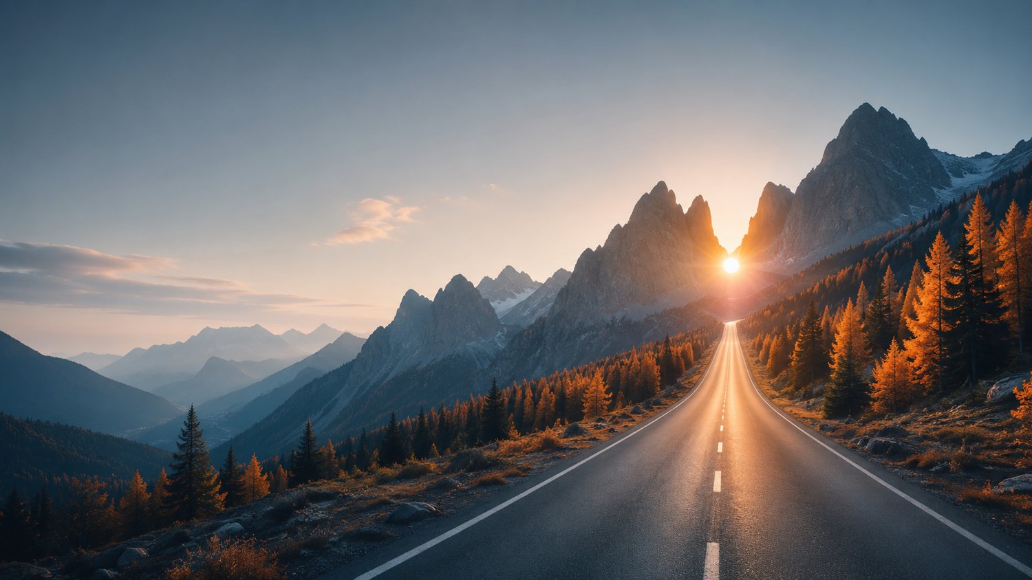An open mountain road leading toward a sunrise breaking between two peaks, evoking a fresh start.